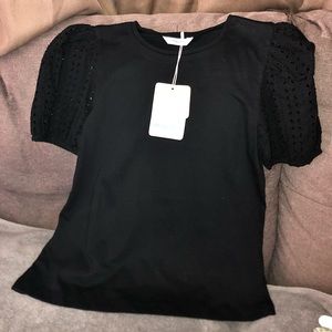 NWT. Girls eyelet short sleeve shirt by mayoral. Available in sizes 12,14, & 16.